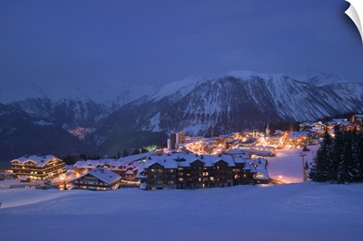 Buildings lit up at dusk, Courchevel, French Alps, France