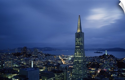 Buildings lit up at dusk, Transamerica Pyramid, Coit Tower, San Francisco, California,