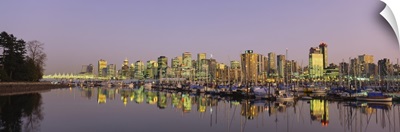 Buildings lit up at dusk, Vancouver, British Columbia, Canada