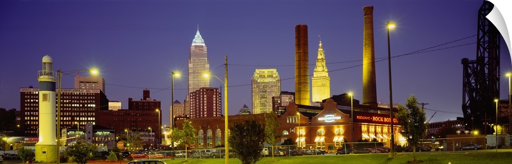 Panoramic image of buildings lit up at night in a downtown Ohio city.