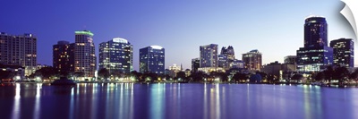 Buildings lit up at night in a city Lake Eola Orlando Orange County Florida