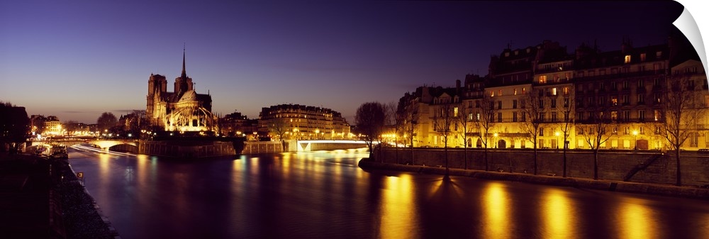 Buildings lit up at night, Notre Dame, Seine River, Paris, Ile-De-France, France
