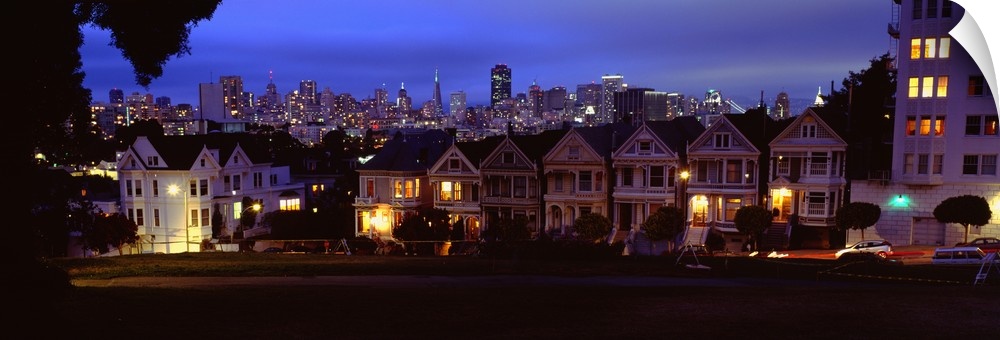 San Francisco's Painted Ladies of Alamo Square with building skyline in the background.