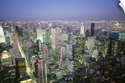 Buildings lit up in a city a night, Manhattan, New York City, New York