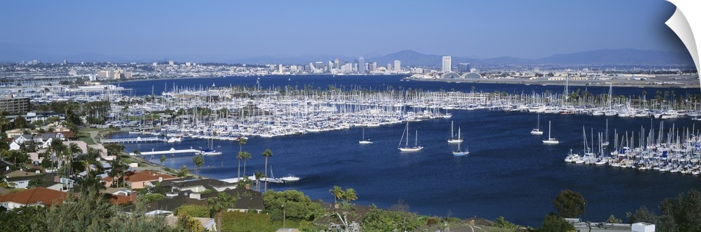 A panoramic aerial view of the boats in the water of San Diego harbor.