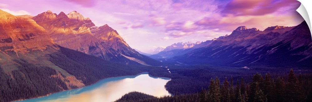 A colorful sunrise over the mountains of Peyto Lake in Alberta, Canada.
