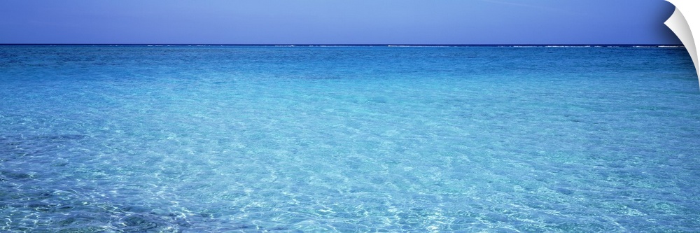 Long panoramic photo print of crystal clear ocean water in the Caribbean.