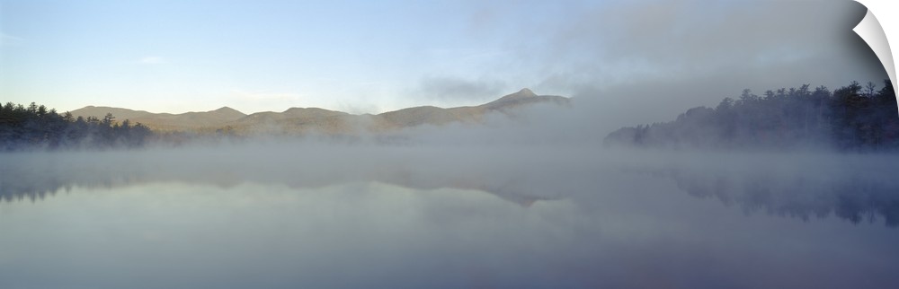Wall art for the home or office this panoramic photograph shows mist rising off a New England lake.