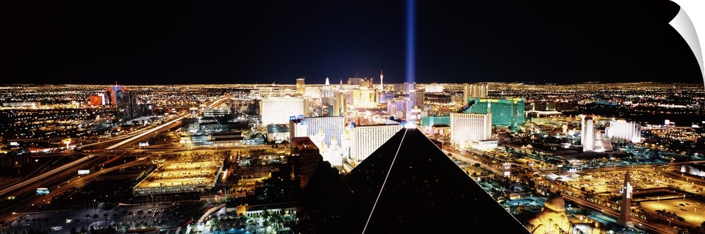 Giant, wide angle landscape photograph of Las Vegas at night, taken looking downward from Mandalay Bay Resort and Casino.