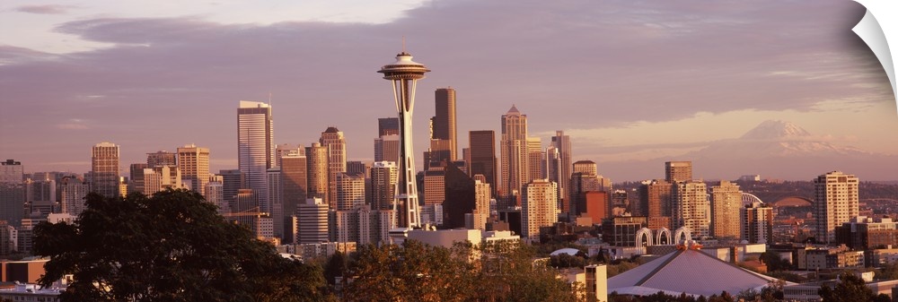 Big horizontal photograph the Seattle skyline, including the Space Needle, taken from Queen Anne Hill, a cloudy sky in the...
