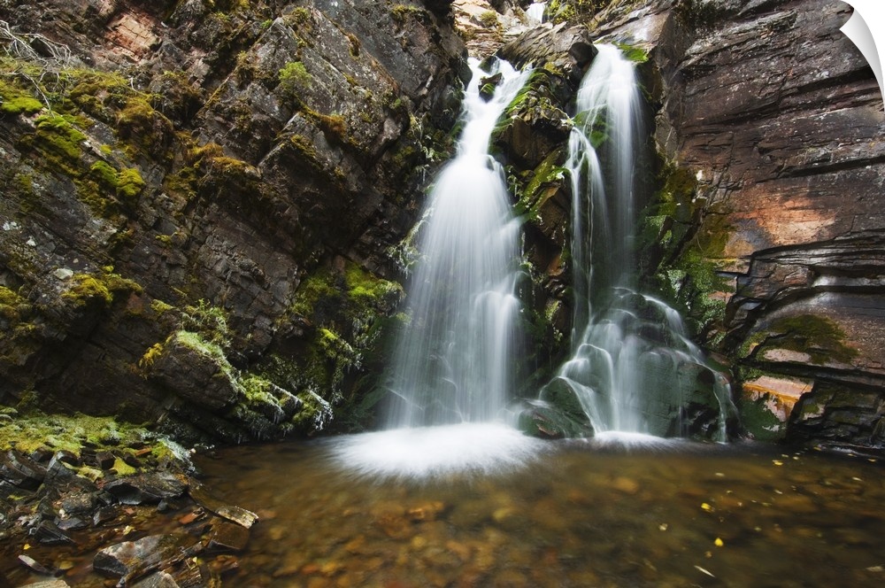 Photo on canvas of water falling from a rocky cliff into a pool of water in Montana.