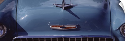 Close-up of a hood ornament of a 57 Chevy car