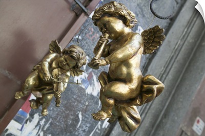 Close-up of two golden cherubs, Naples, Campania, Italy