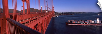 Container ship passing under a suspension bridge Golden Gate Bridge San Francisco Bay San Francisco California