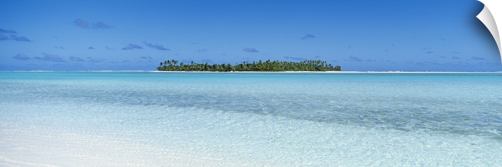 Panoramic photograph on a big canvas of the clear blue waters of the South Pacific, the Cook Islands on the distant horizo...