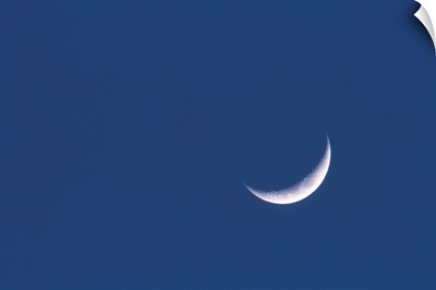 Crescent moon in deep blue sky