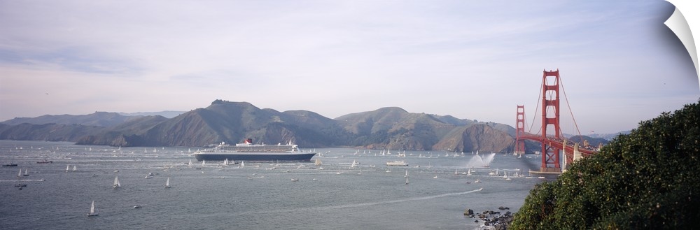 Cruise ship approaching a suspension bridge, RMS Queen Mary 2, Golden Gate Bridge, San Francisco, California