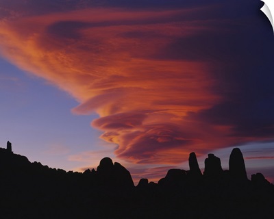 Cyclone shaped clouds over rocks, Californian Sierra Nevada, California