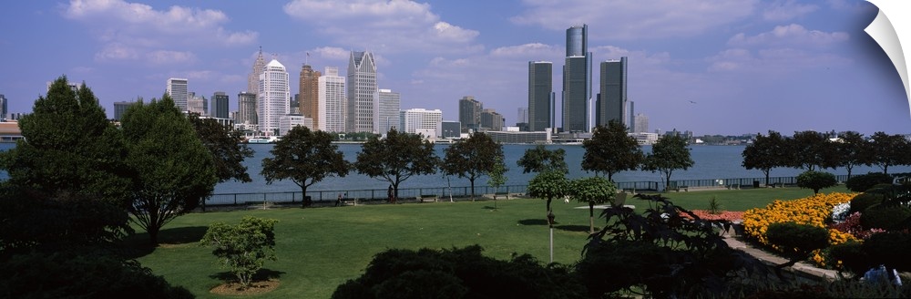 This wall art is a panoramic photograph of the city skyline taken from a park across the water.
