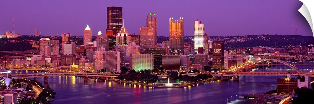 Large print of a horizontal photograph of skyline in Pittsburgh, Pennsylvania at night.