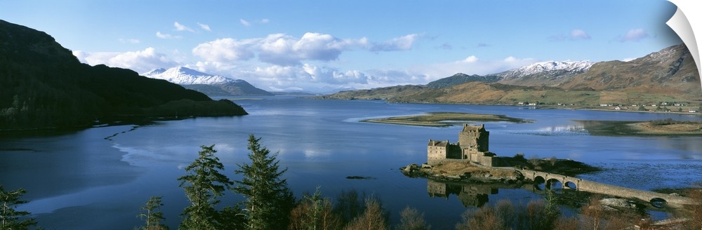 Aerial photograph of the Eilean Donan castle on an island where the three great sea lochs meet in Scotland.