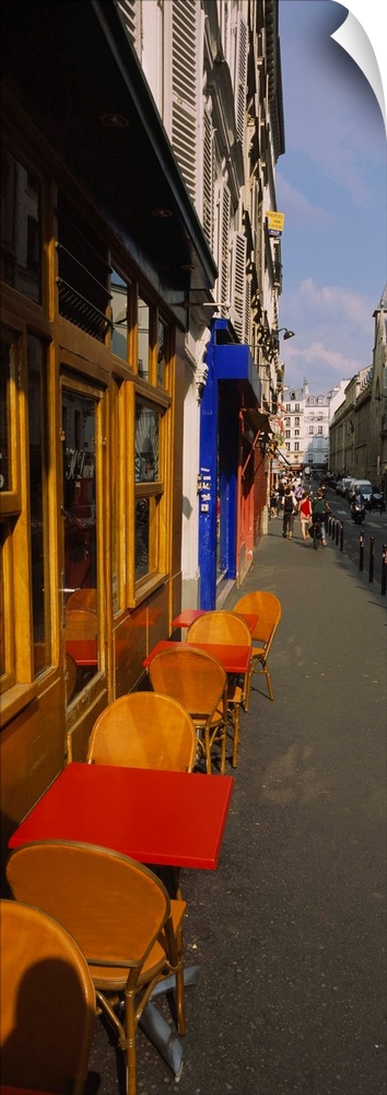 Empty chairs and tables at a sidewalk cafe, Paris, France