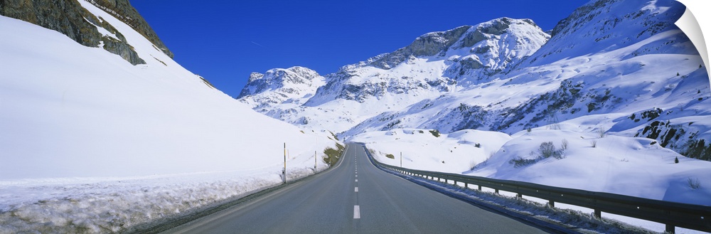Empty road passing through a polar landscape, Route 3, Graubunden, Switzerland