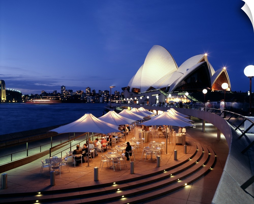 A panorama of Sydney, Autralia's waterfront, featuring the Sydney Opera House and cafe.