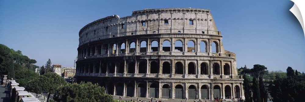 Wide angle photograph taken of the famous coliseum in Rome.
