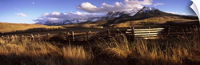 Fence with mountains in the background, Colorado,
