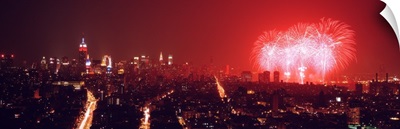 Fireworks display at night over a city, New York City, New York State