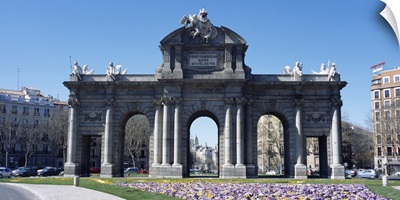 Formal garden in front of a memorial gate, Alcala Gate, Plaza de la Independencia, Madrid, Spain