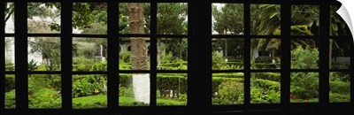 Formal garden viewed through a window, Hosteria La Cienega, Latacunga, Cotopaxi, Ecuador