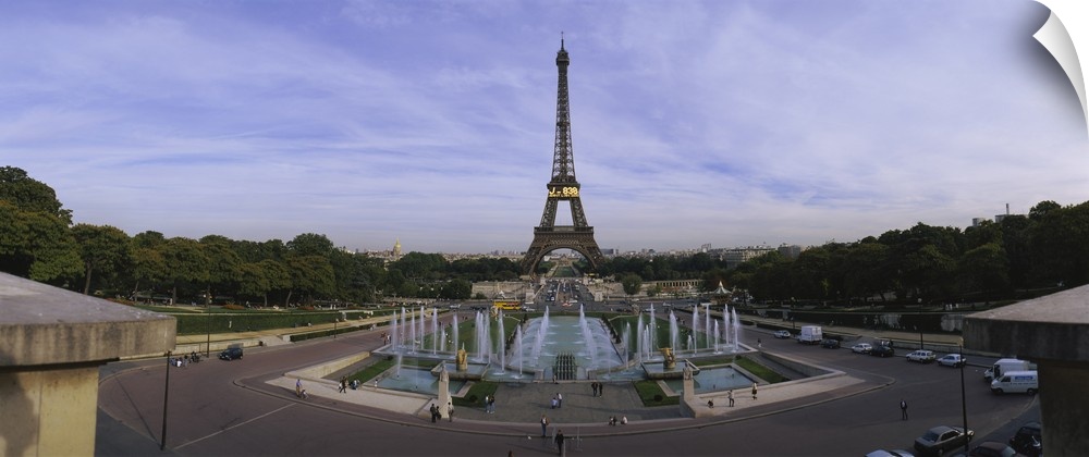 Fountain in front of a tower, Eiffel Tower, Paris, France