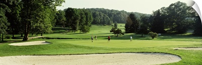 Four people playing on a golf course, Baltimore County, Maryland