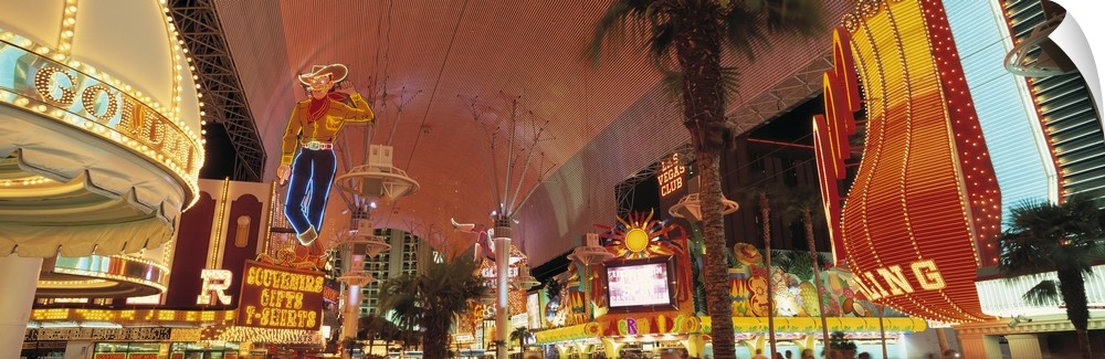 Horizontal photo of the Las Vegas Strip lit up from street view.