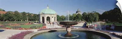 Germany, Munich, Hofgarten, Tourist sitting in the park