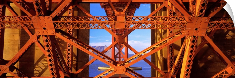 Closeup artwork of the Golden Gate Bridge in San Francisco, California (CA). A large ship and mountain are visible in the ...