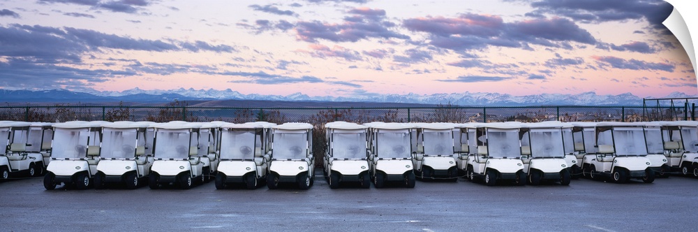 Golf carts parked in a parking lot, Rocky Mountains, Cochrane, Alberta, Canada