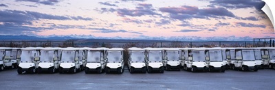 Golf carts parked in a parking lot, Rocky Mountains, Cochrane, Alberta, Canada