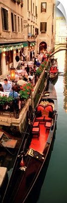 Gondolas moored outside of a cafe, Venice, Italy