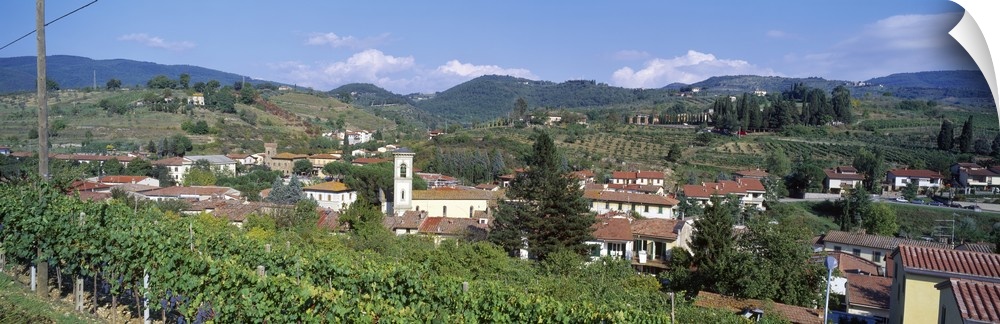 Panoramic canvas photo of an Italian town on rolling hills.