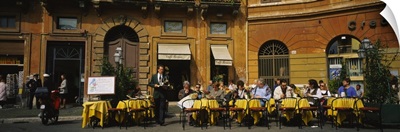Group of people at a sidewalk cafe, Rome, Italy