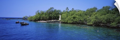 Group of people boating besides a monument, Captain Cook Monument, Kealakekua Bay, Hawaii