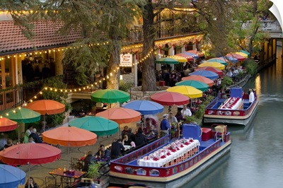 Group of people in a restaurant along a river, San Antonio River, San Antonio, Texas