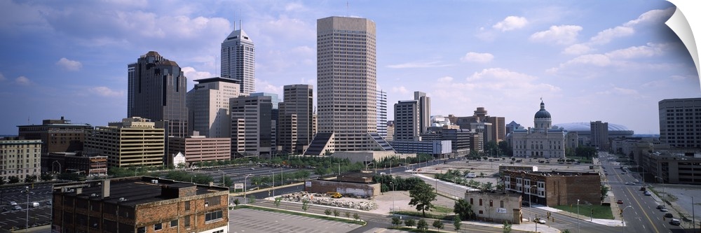Photograph from above of the city skyline of Indianapolis, Indiana on a sunny day.