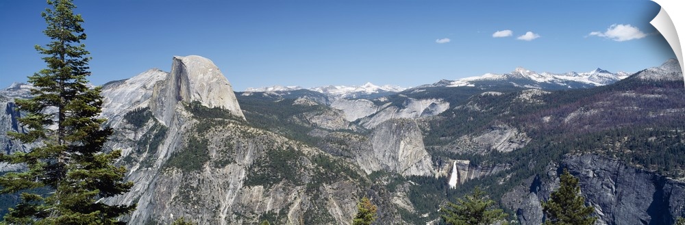 Long and horizontal canvas photo of the Half Dome mountain in Yellowstone with mountains surrounding it.