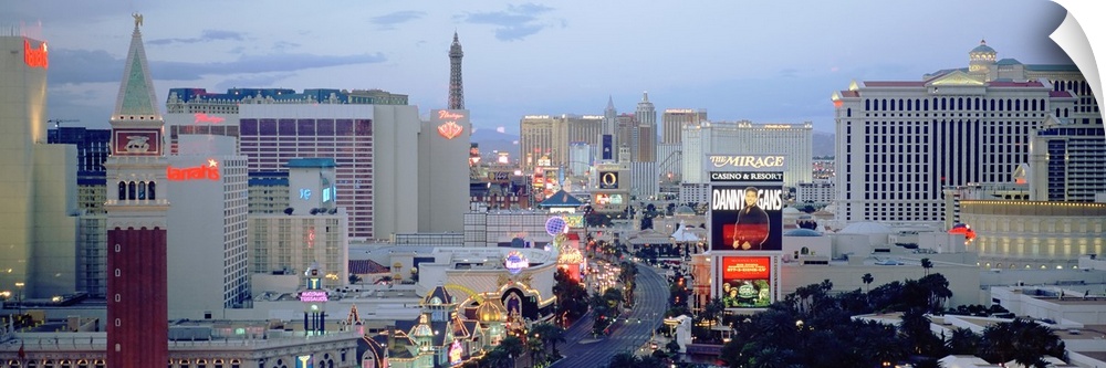 Panoramic photograph taken of part of the strip in Las Vegas during dusk.