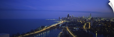 High angle view of buildings lit up at dusk, Lake Michigan, Chicago, Illinois