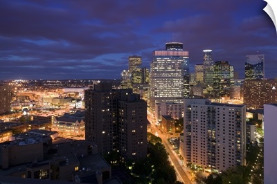 High angle view of buildings lit up at night, Minneapolis, Minnesota